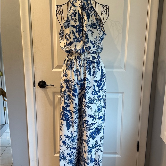 Sleeveless halter style blue, and white floral jumpsuit - Picture 6 of 6